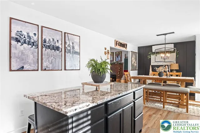a view living room with granite countertop furniture and painting on the wall