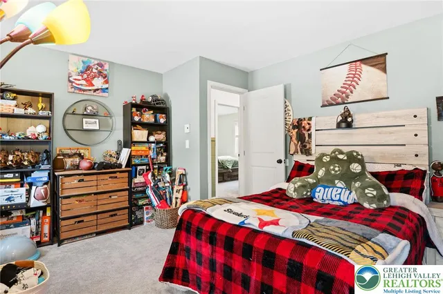 a bedroom with a bed and dresser