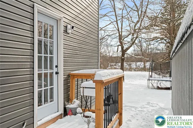 a outdoor view of a house with a tree