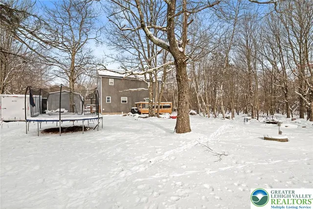 a view of a outdoor space covered with snow in the background