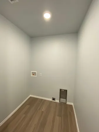 an empty room with wooden floor