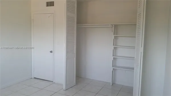 a view of small space with racks on the wall