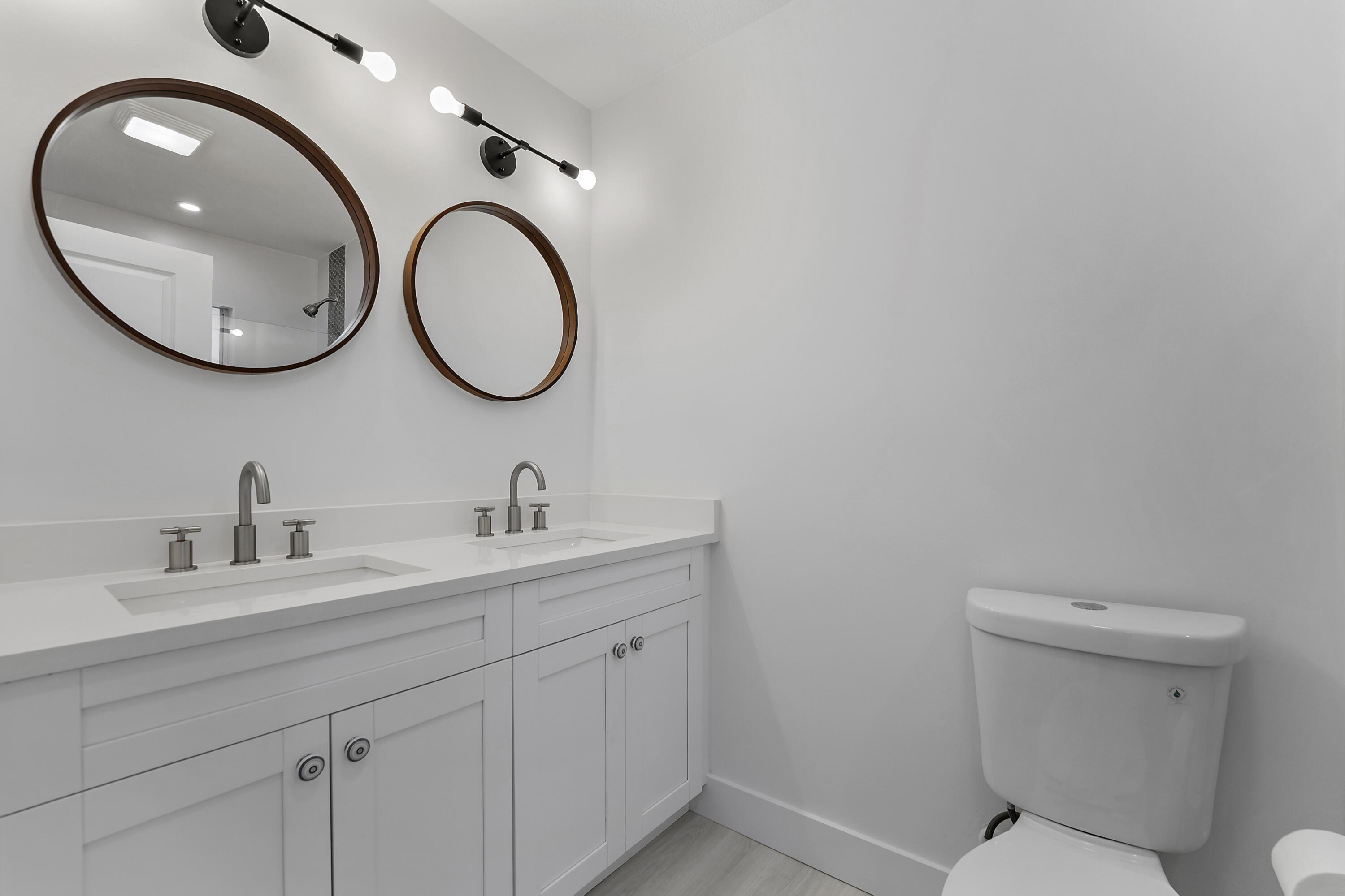 1279 Beach Road, Unit 3 Singer Island, FL 33404 - Photo 13 of 23 a bathroom with a toilet and a sink