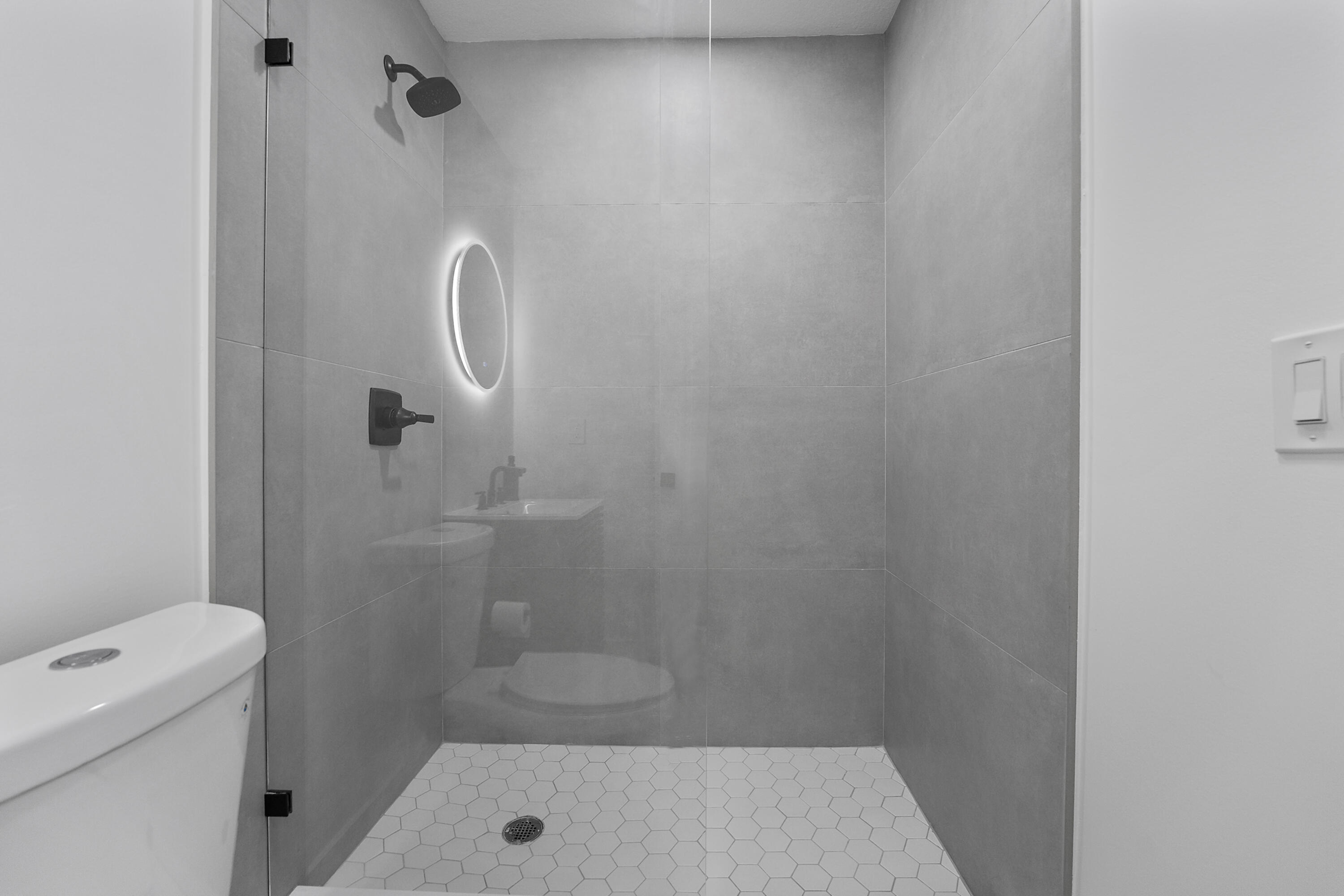 1279 Beach Road, Unit 3 Singer Island, FL 33404 - Photo 18 of 23 a bathroom with a shower