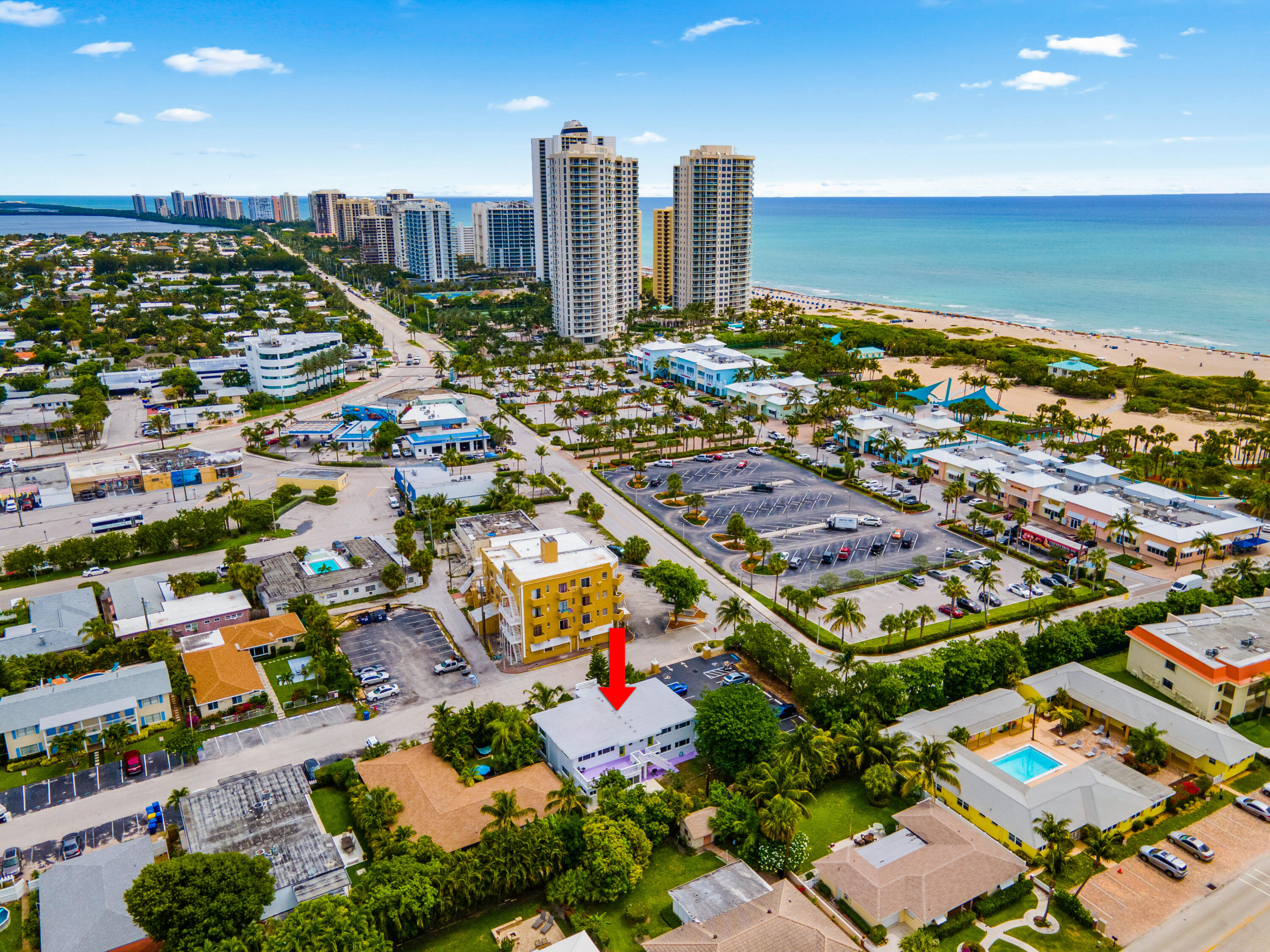 1279 Beach Road, Unit 3 Singer Island, FL 33404 - Photo 2 of 23 an aerial view of city parking and river
