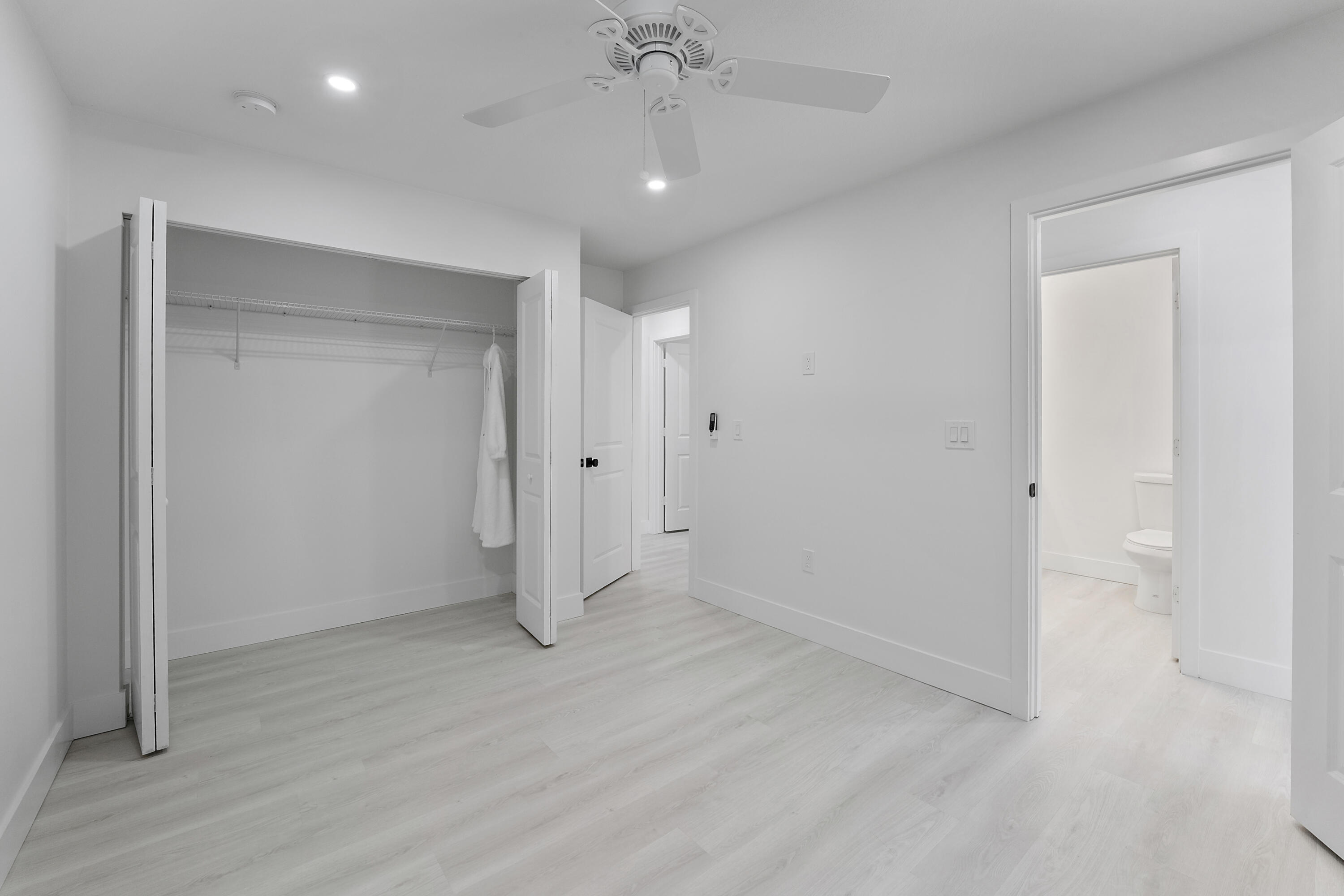 1279 Beach Road, Unit 3 Singer Island, FL 33404 - Photo 21 of 23 an empty room with wooden floor and entryway