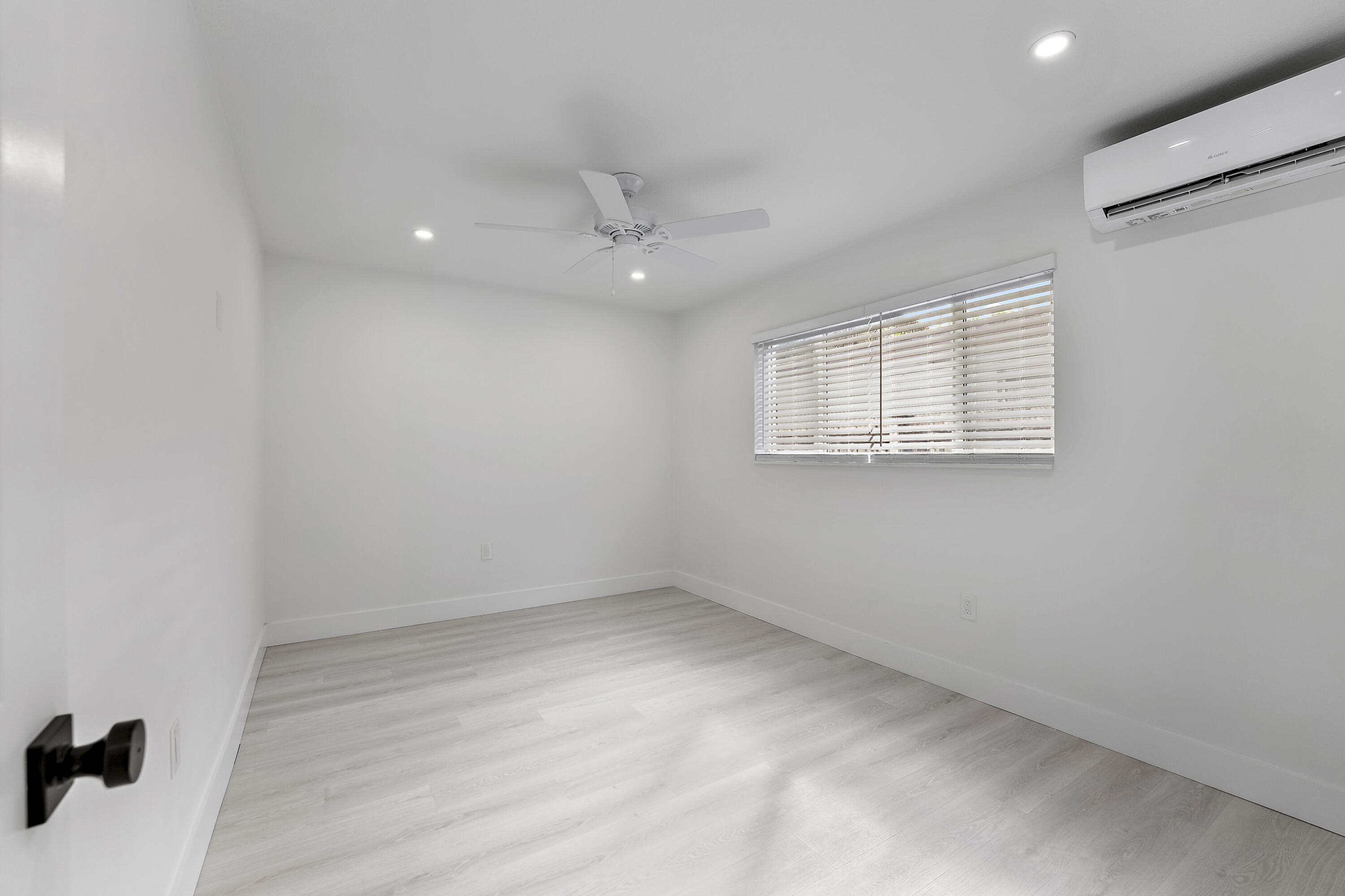 1279 Beach Road, Unit 3 Singer Island, FL 33404 - Photo 22 of 23 an empty room with a window and a ceiling fan