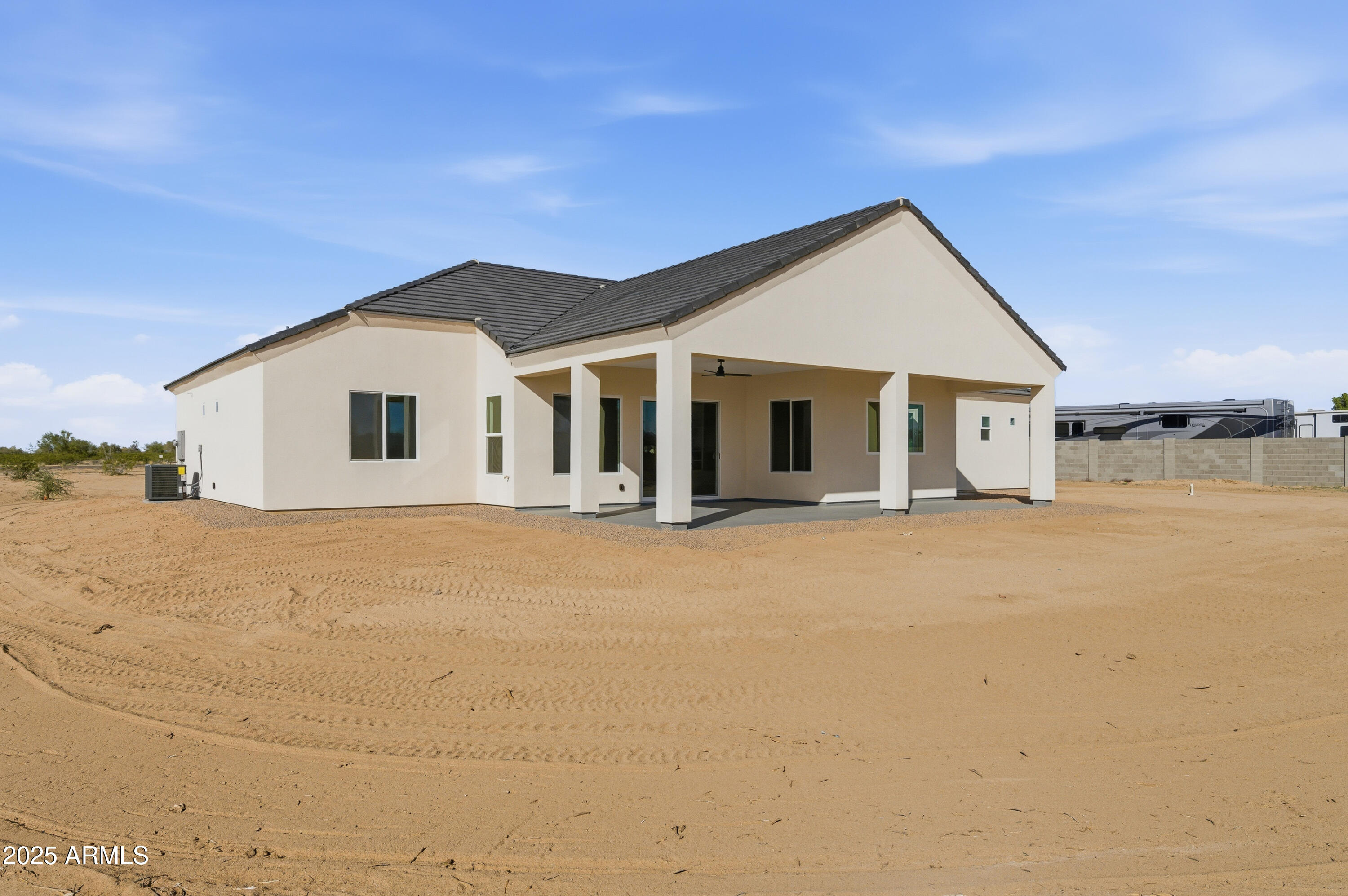 10039 North Burris Road Casa Grande, AZ 85122 - Photo 22 of 61 a view of a white house with a yard
