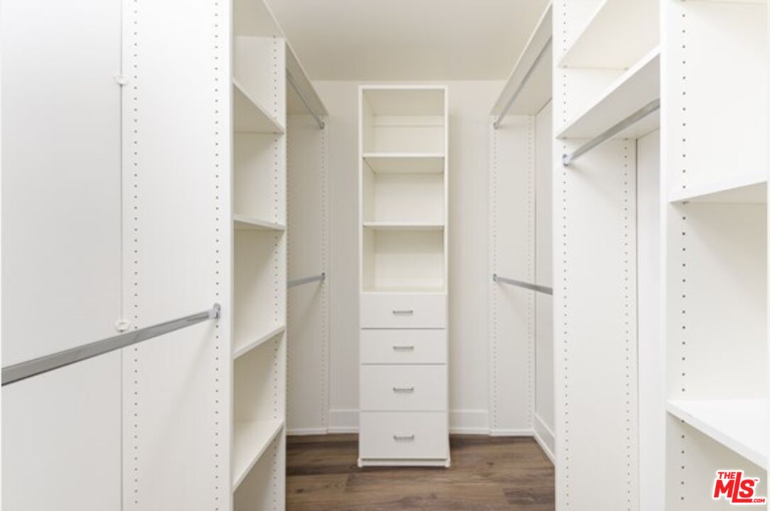 129 South Kings Road, Unit PH5 Los Angeles, CA 90048 - Photo 10 of 14 a view of walk in closet with empty racks