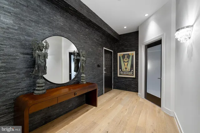 a bathroom with a sink a mirror and a vanity