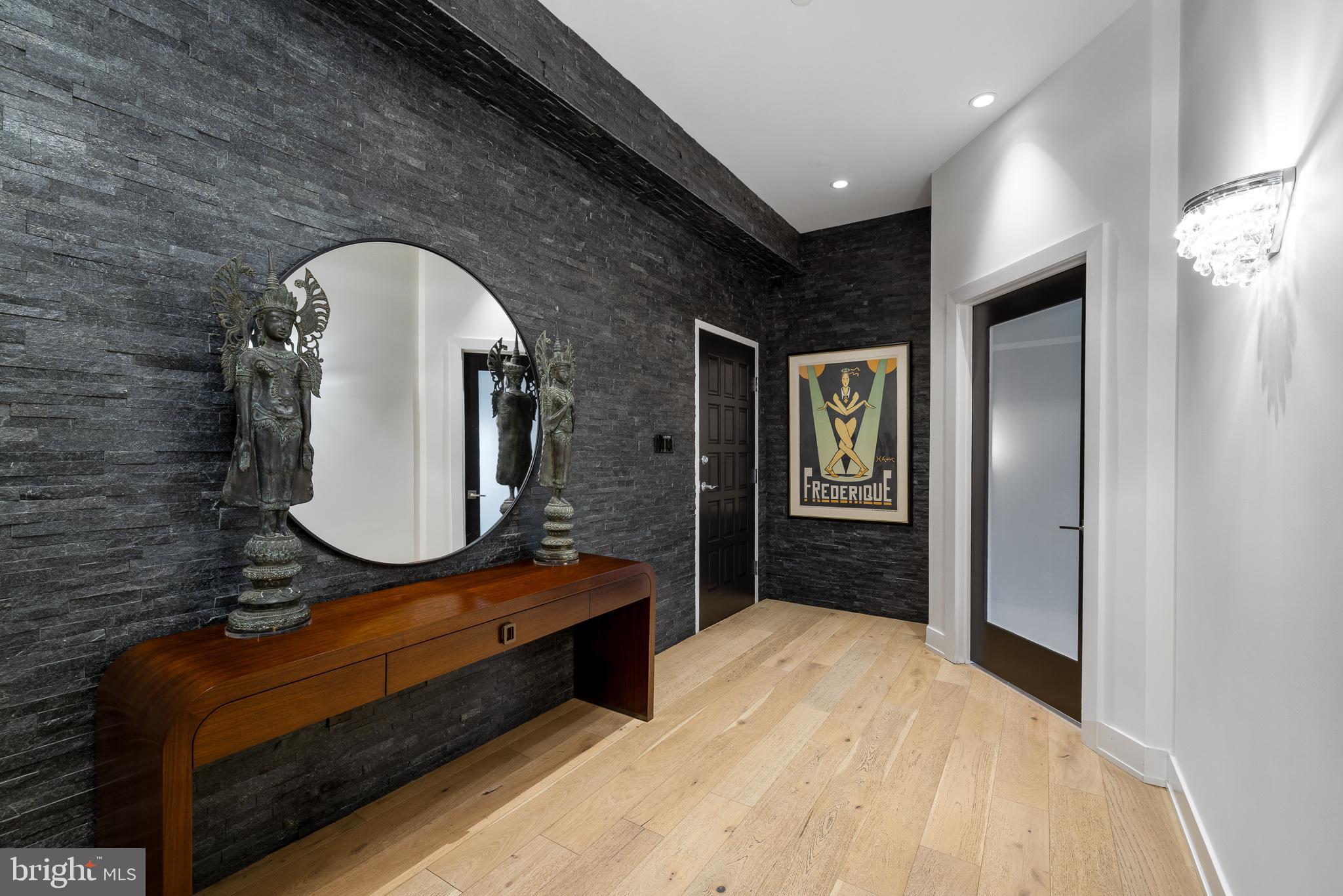 20 Letitia Street, Unit 5B Philadelphia, PA 19106 - Photo 11 of 44 a bathroom with a sink a mirror and a vanity