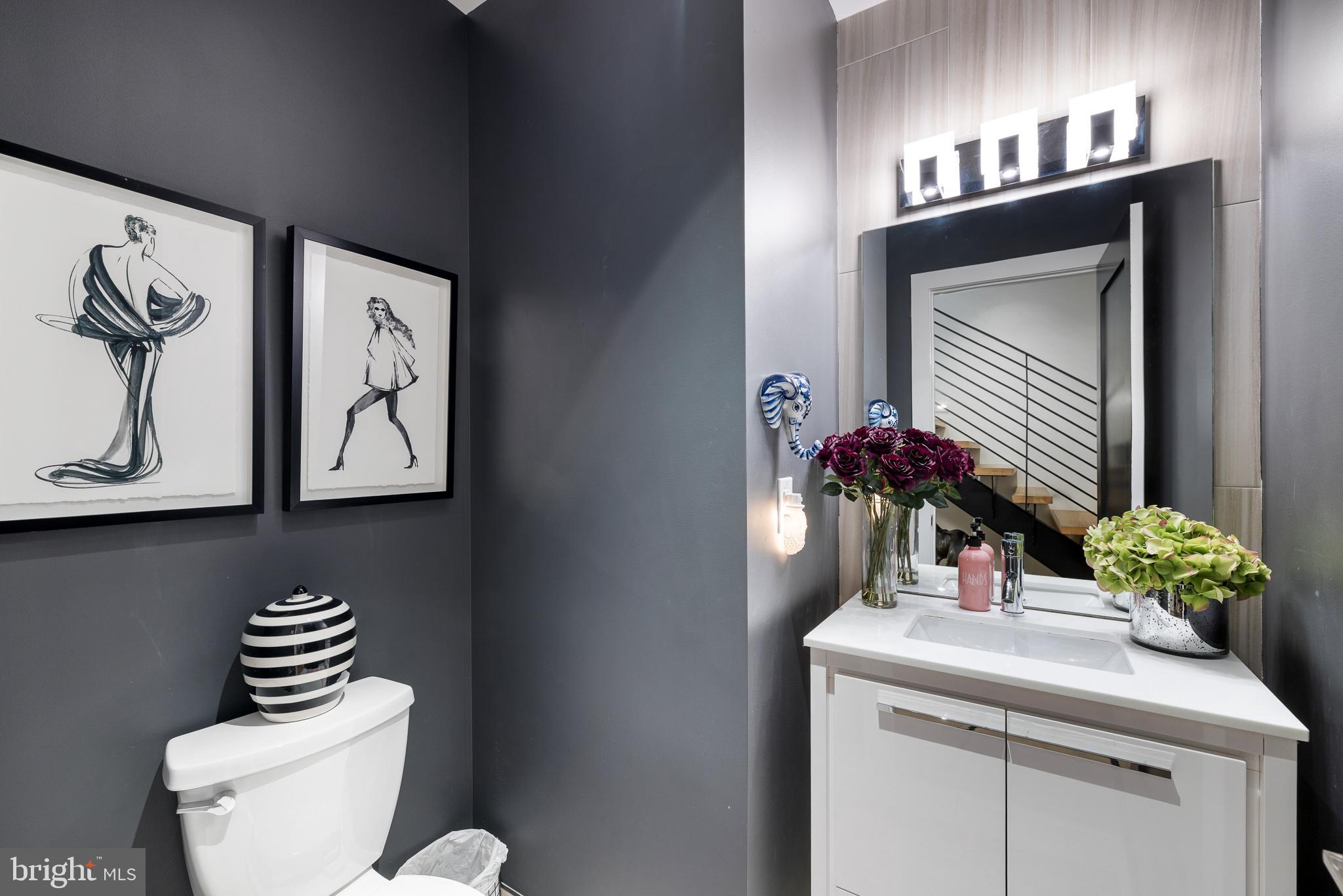 20 Letitia Street, Unit 5B Philadelphia, PA 19106 - Photo 13 of 44 a bathroom with a toilet sink and mirror
