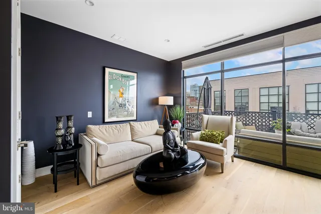 a spacious bedroom with a bed and a large window