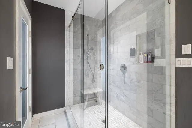 a bathroom with a bathtub and shower