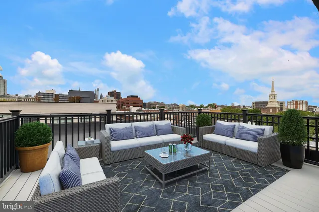 a view of roof deck with patio