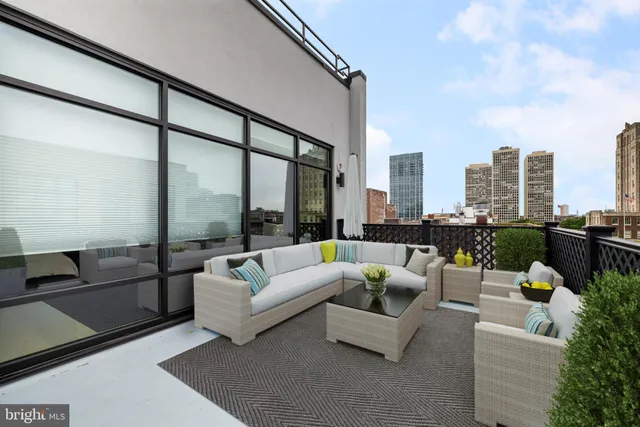 a view of a terrace with furniture