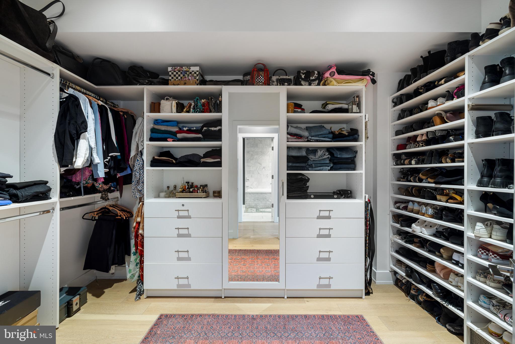 20 Letitia Street, Unit 5B Philadelphia, PA 19106 - Photo 35 of 44 a view of walk in closet with clothes and shoes