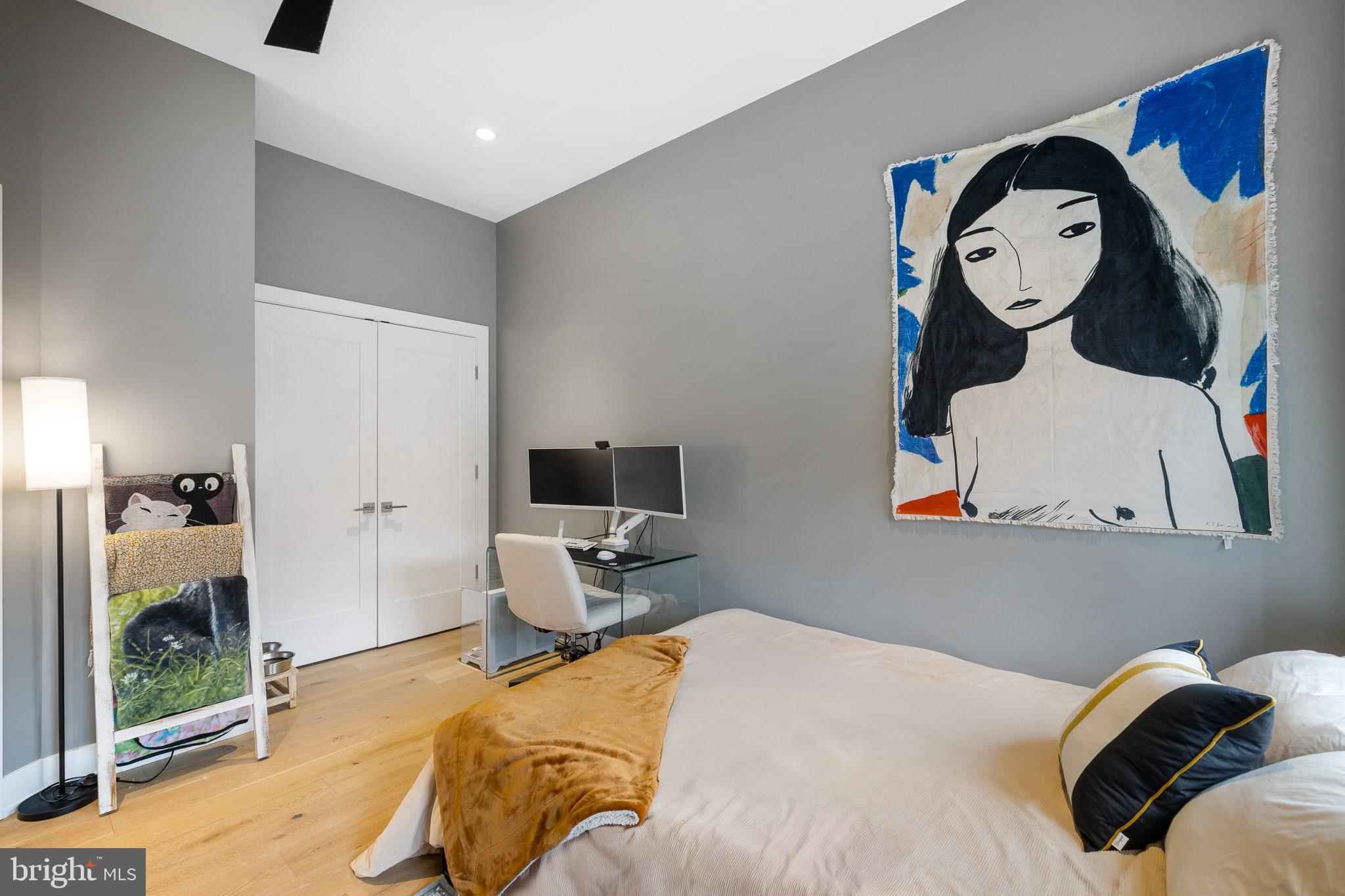 20 Letitia Street, Unit 5B Philadelphia, PA 19106 - Photo 41 of 44 a bedroom with a bed and a chandelier