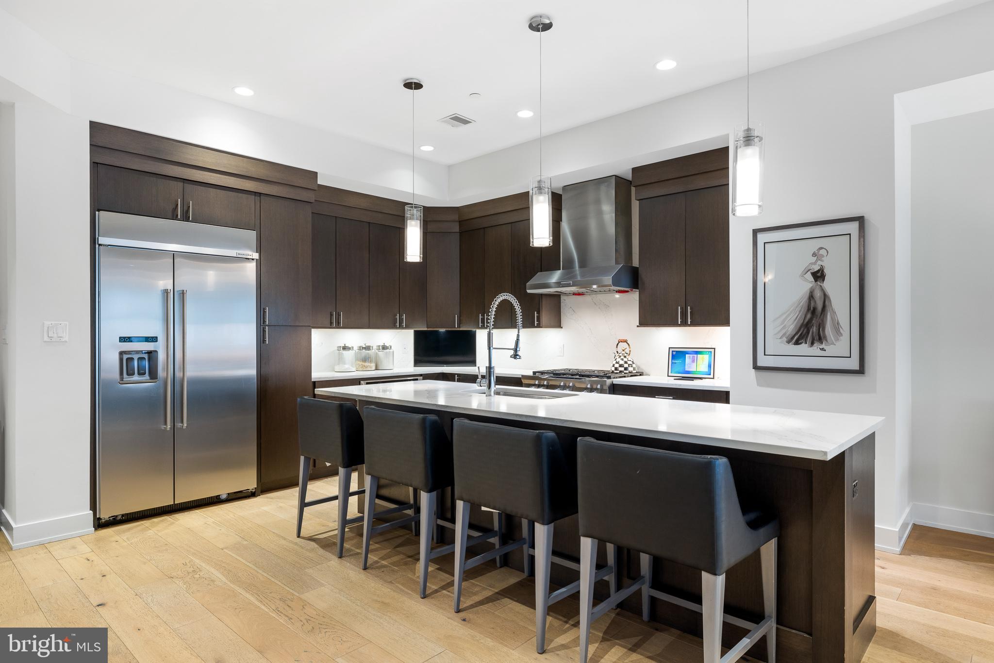 20 Letitia Street, Unit 5B Philadelphia, PA 19106 - Photo 6 of 44 a kitchen with stainless steel appliances granite countertop a sink and a refrigerator