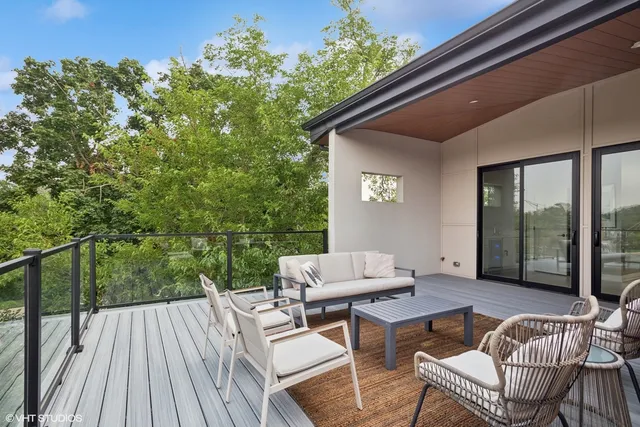 a patio with yard glass top table and chairs