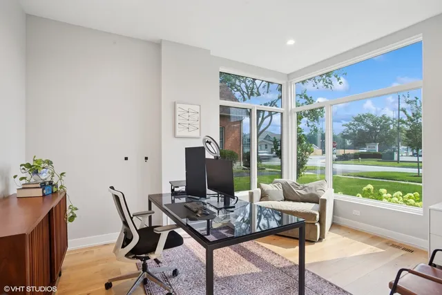 a living room with furniture and a floor to ceiling window