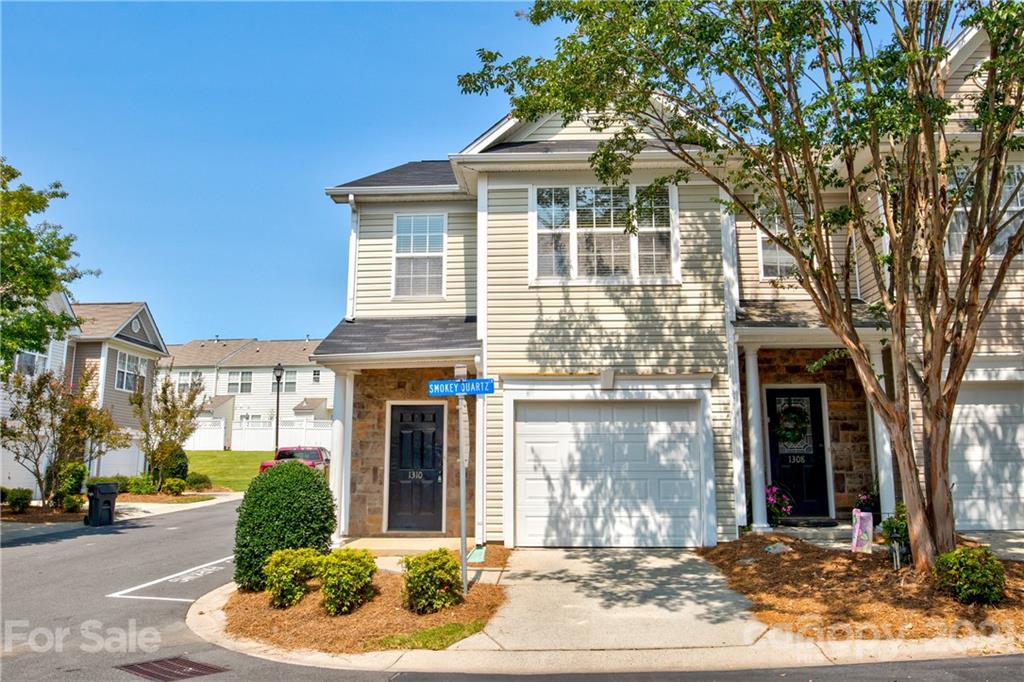 1310 Smokey Quartz Lane Fort Mill, SC 29708 - Photo 1 of 18 a front view of a house with a yard