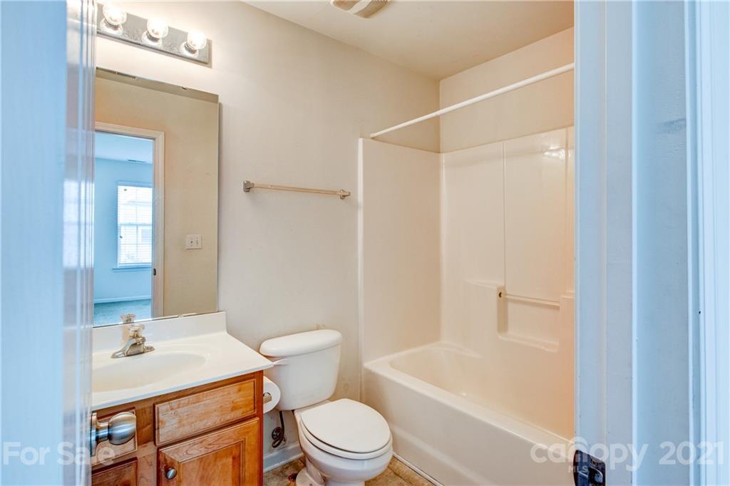 1310 Smokey Quartz Lane Fort Mill, SC 29708 - Photo 13 of 18 a bathroom with a sink toilet vanity and shower