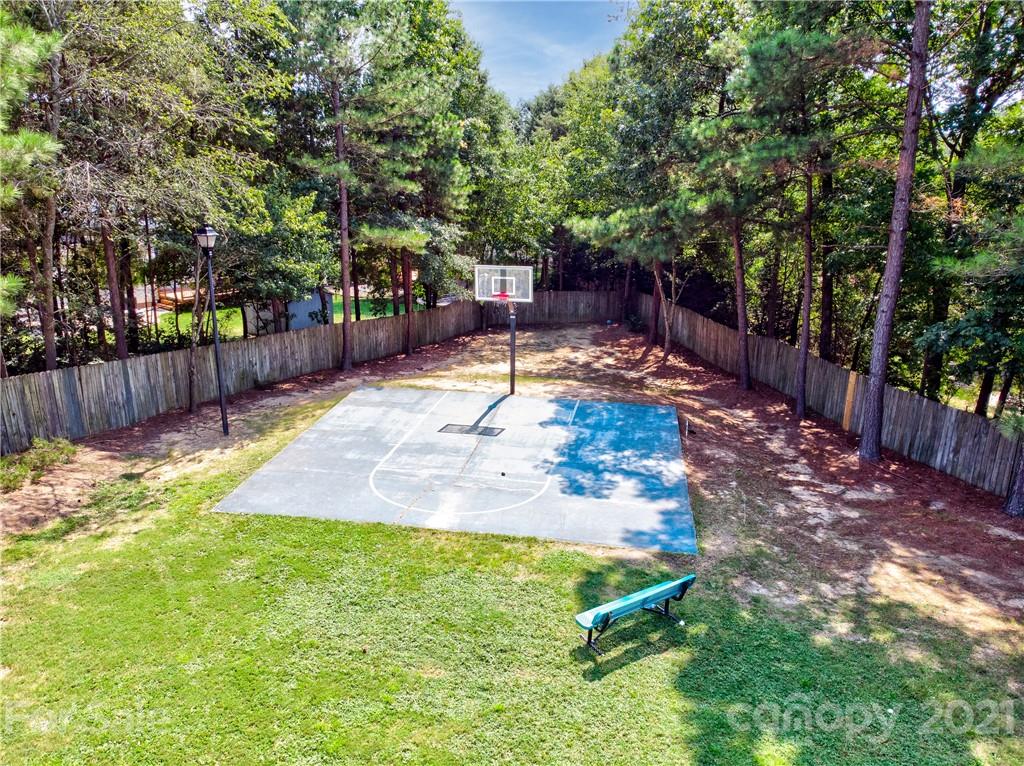 1310 Smokey Quartz Lane Fort Mill, SC 29708 - Photo 17 of 18 a backyard of a house with lots of green space