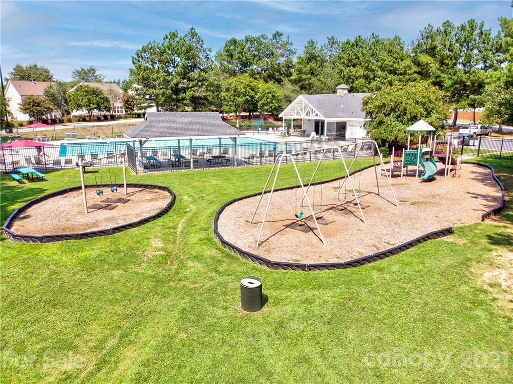 1310 Smokey Quartz Lane Fort Mill, SC 29708 - Photo 18 of 18 a view of a swimming pool with a patio