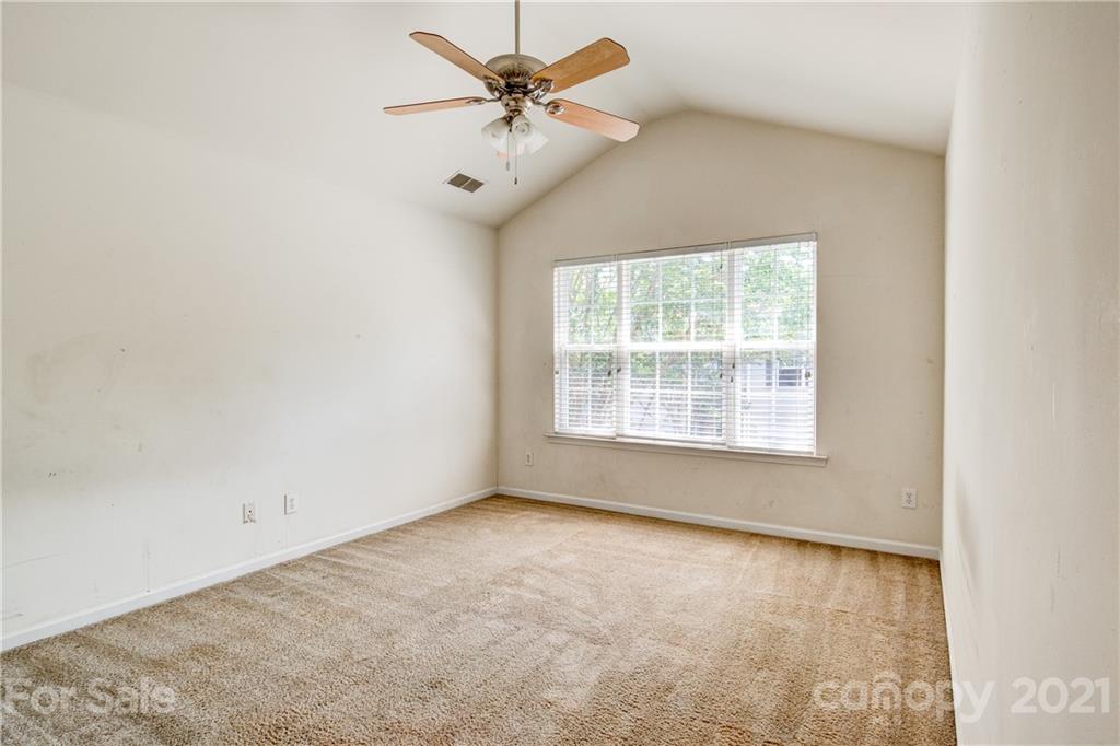 1310 Smokey Quartz Lane Fort Mill, SC 29708 - Photo 10 of 18 an empty room with a window and a fan