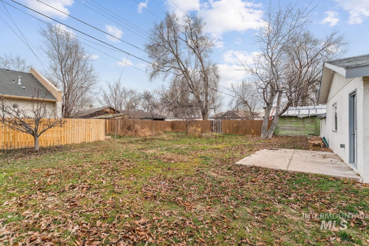 317 East Ithaca Street Caldwell, ID 83605 - Photo 47 of 49 Fenced backyard with a patio area