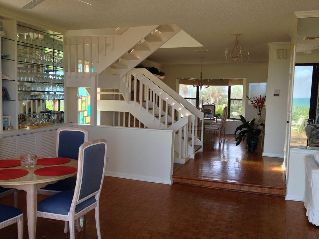 170 Celestial Way, Unit 46 Juno Beach, FL 33408 - Photo 11 of 33 a view of a dining room with furniture window and wooden floor