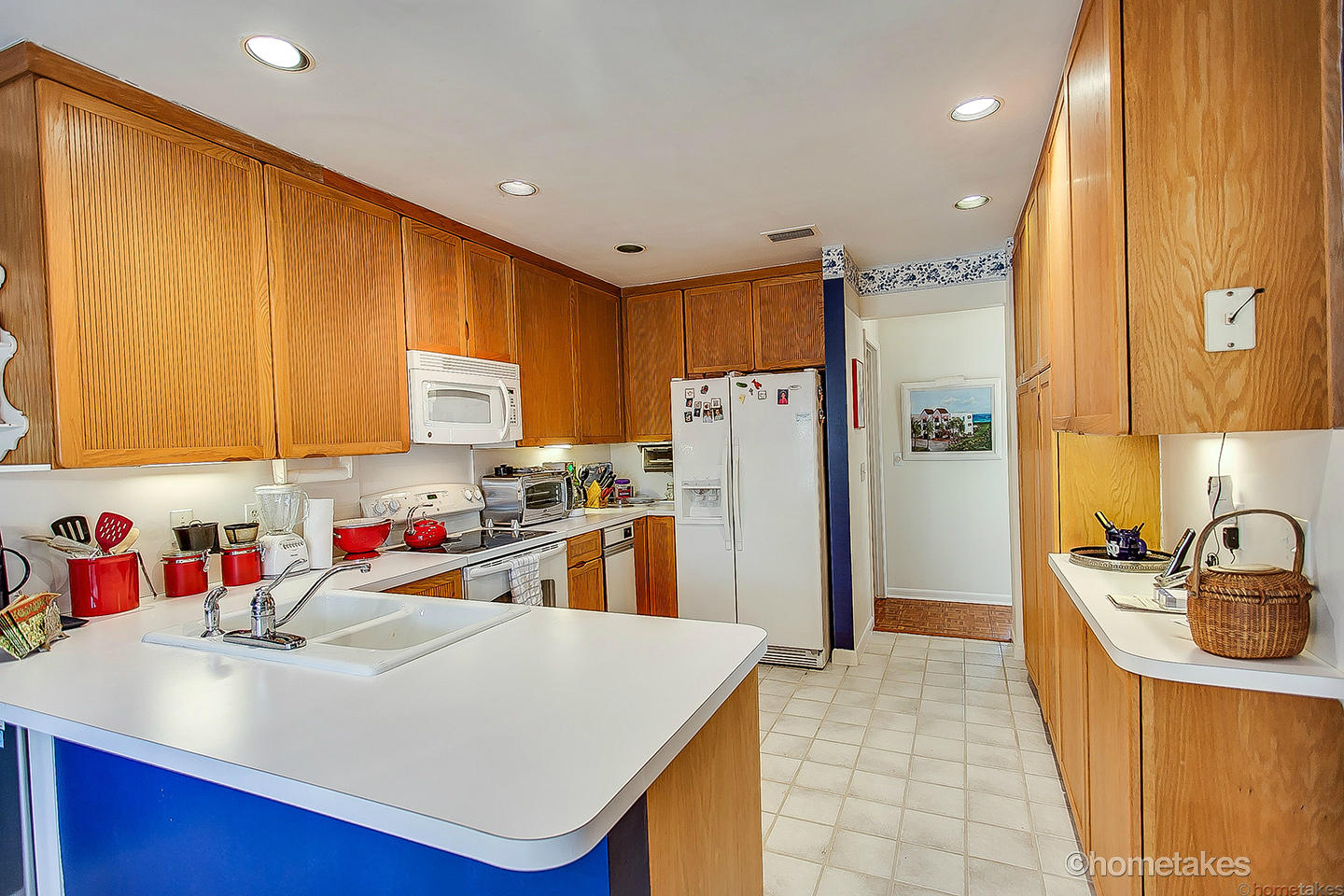170 Celestial Way, Unit 46 Juno Beach, FL 33408 - Photo 14 of 33 a kitchen with refrigerator and cabinets