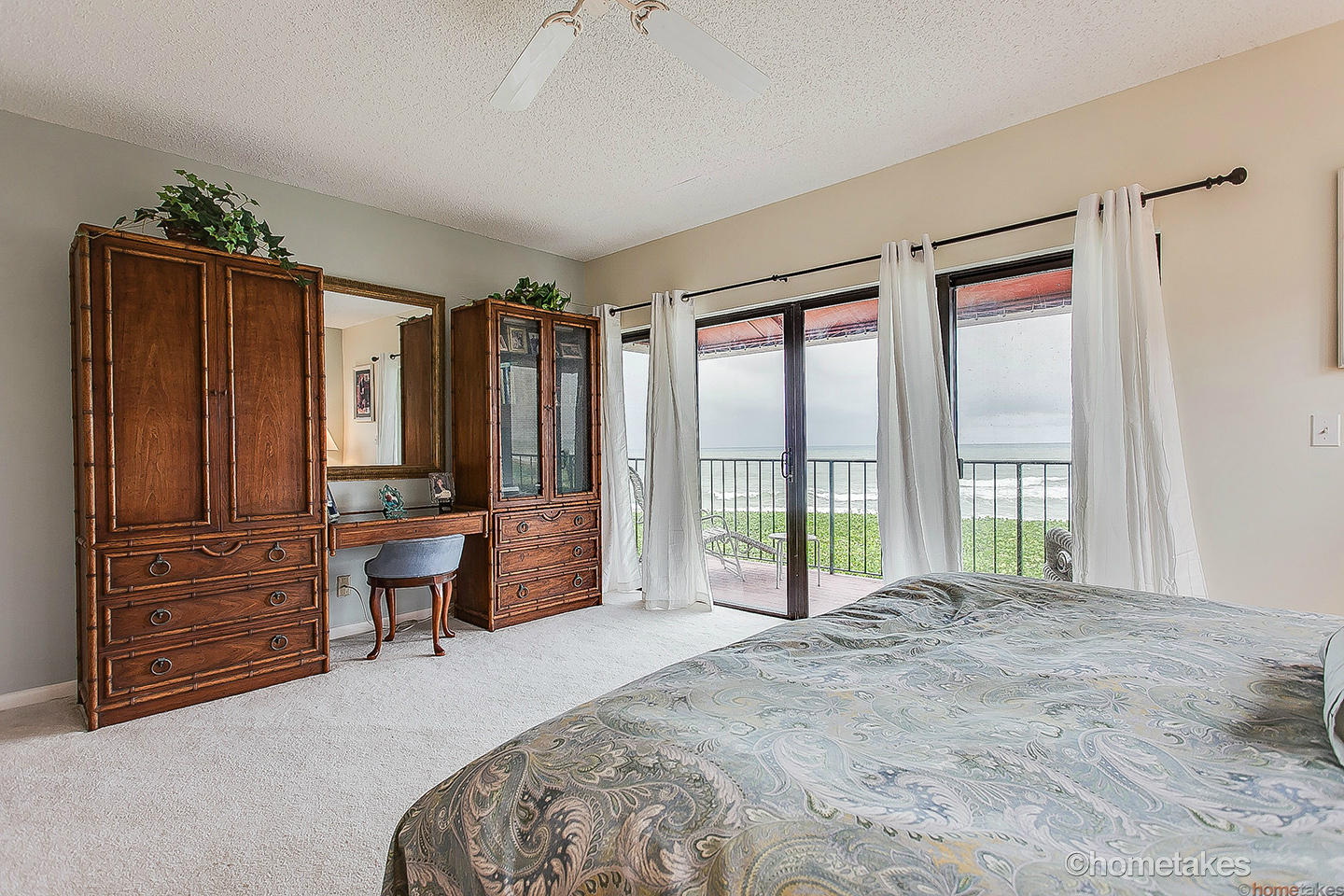 170 Celestial Way, Unit 46 Juno Beach, FL 33408 - Photo 18 of 33 a spacious bedroom with a large bed and a window