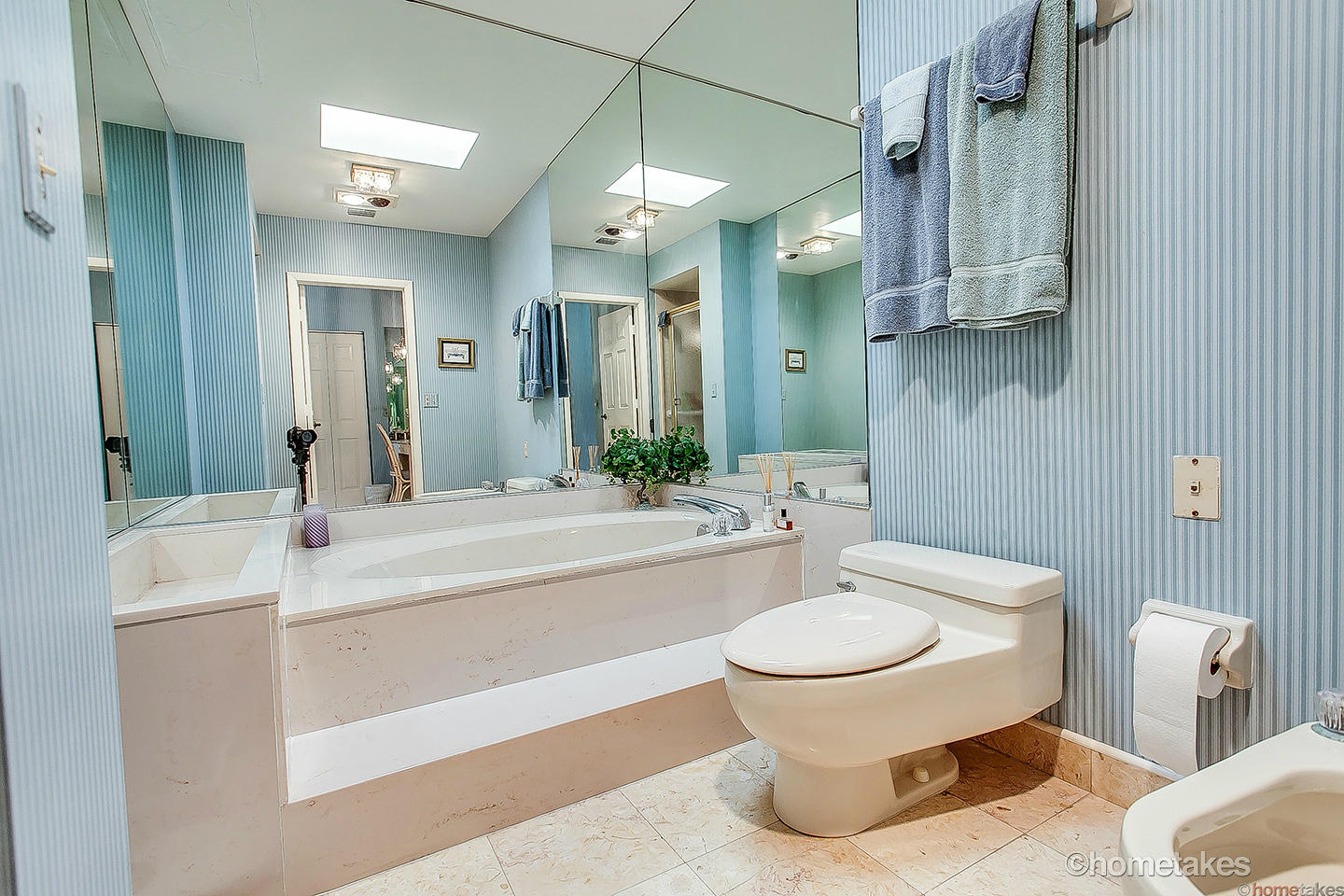 170 Celestial Way, Unit 46 Juno Beach, FL 33408 - Photo 19 of 33 a bathroom with a toilet a sink and a mirror