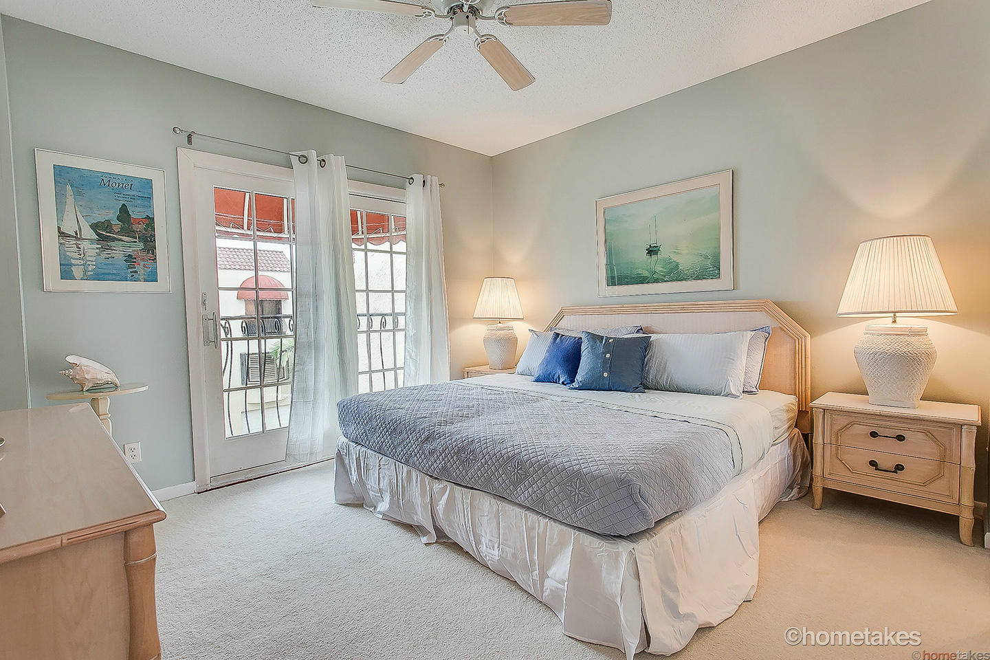 170 Celestial Way, Unit 46 Juno Beach, FL 33408 - Photo 21 of 33 a spacious bedroom with a bed and a lamp