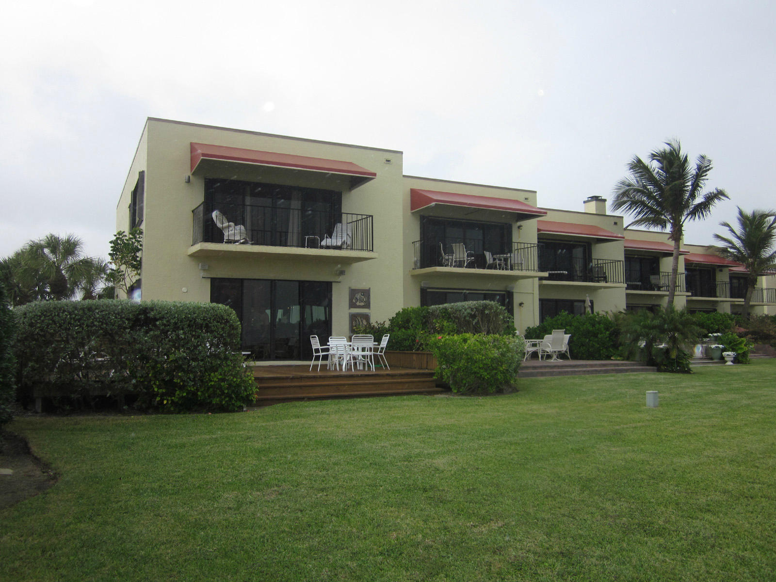 170 Celestial Way, Unit 46 Juno Beach, FL 33408 - Photo 24 of 33 a front view of house with yard and green space