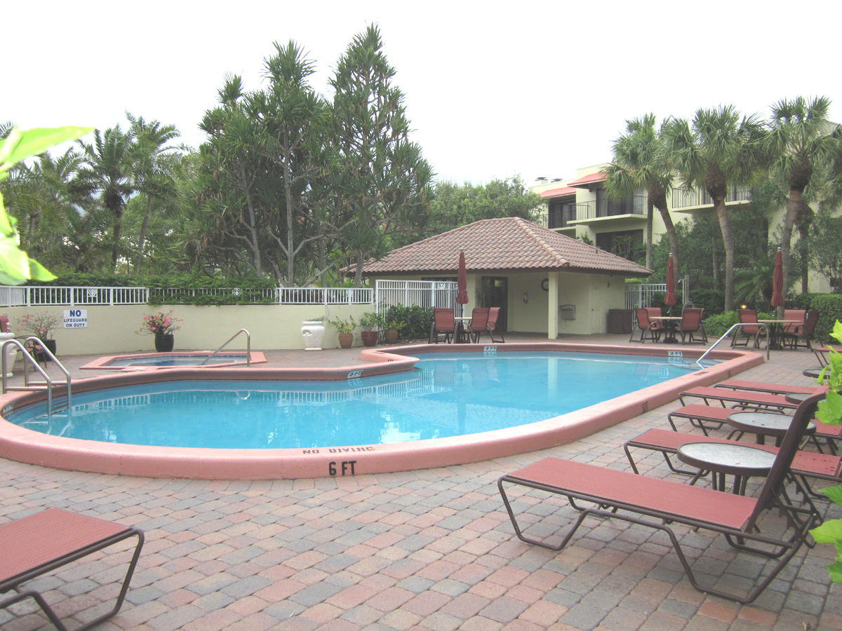 170 Celestial Way, Unit 46 Juno Beach, FL 33408 - Photo 31 of 33 swimming pool view with a seating space