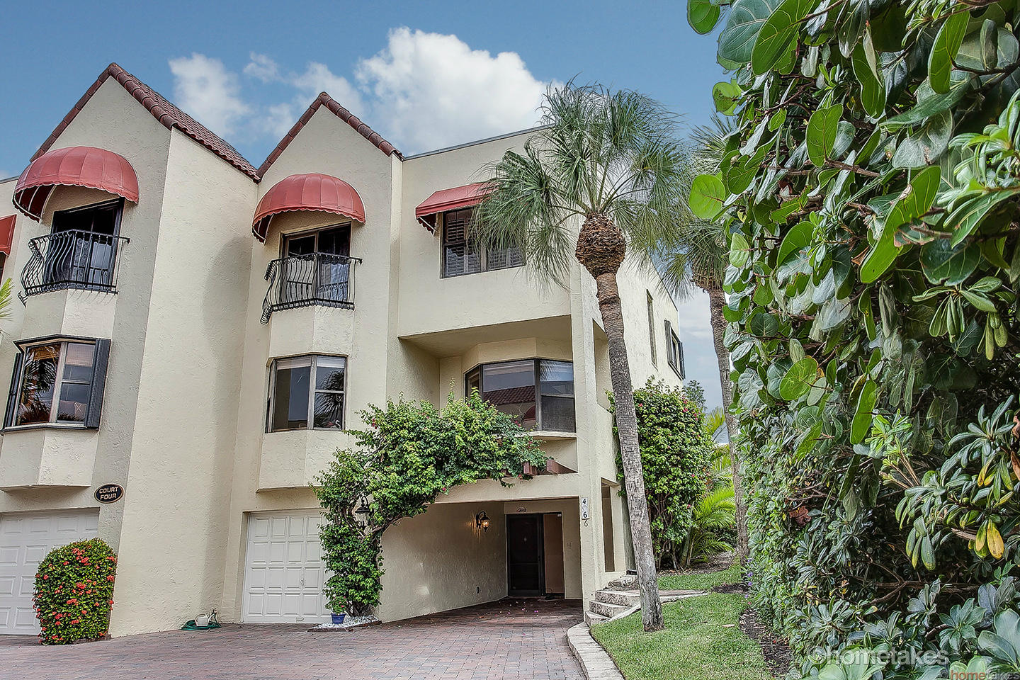 170 Celestial Way, Unit 46 Juno Beach, FL 33408 - Photo 4 of 33 a front view of a house with plants