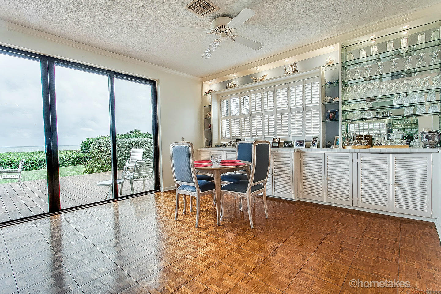 170 Celestial Way, Unit 46 Juno Beach, FL 33408 - Photo 8 of 33 a dining room with furniture and large windows
