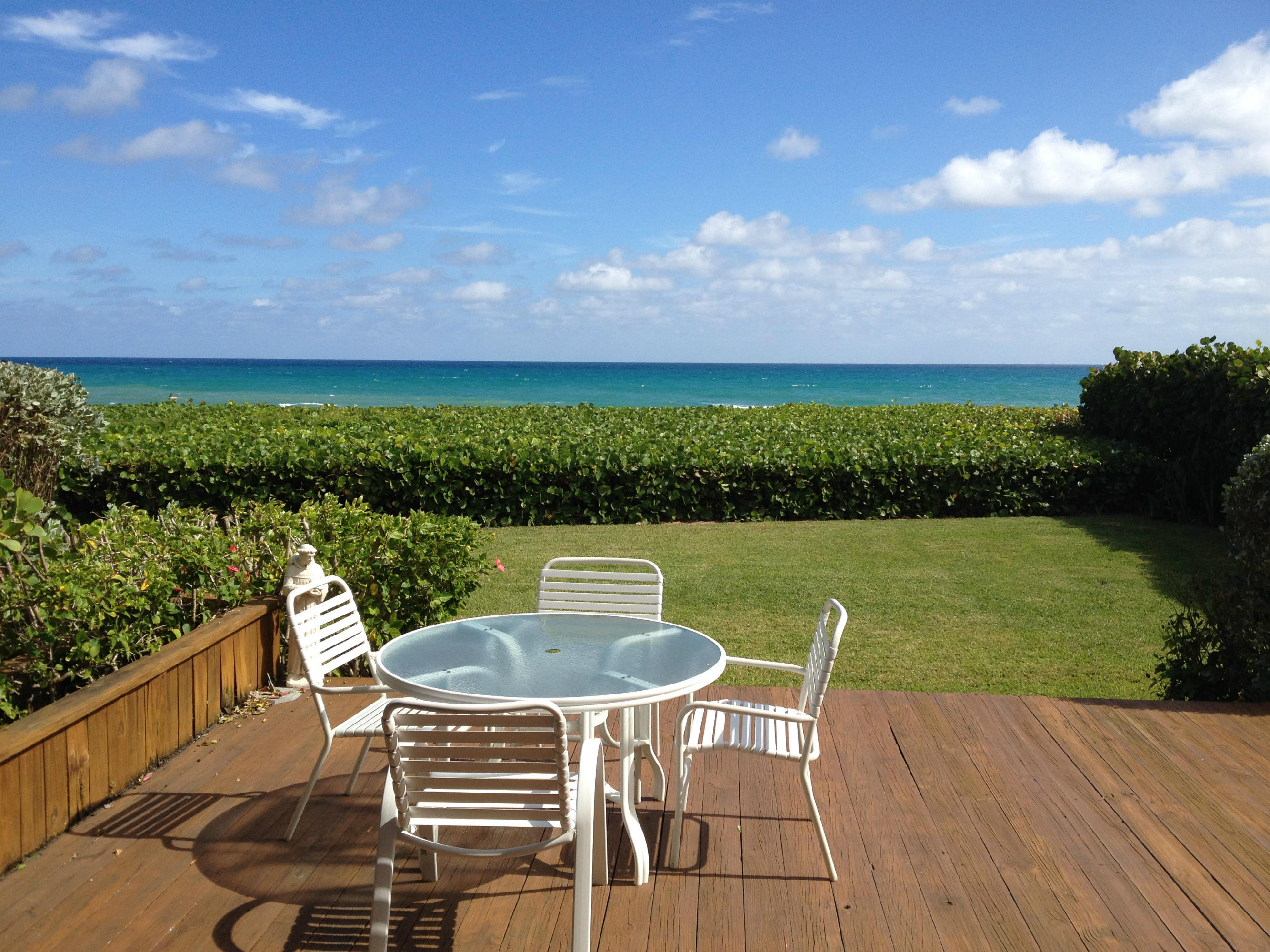 170 Celestial Way, Unit 46 Juno Beach, FL 33408 - Photo 10 of 33 a view of a chairs and table in the roof deck