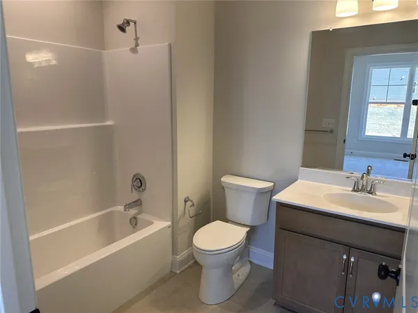 a bathroom with a sink a toilet and a bathtub