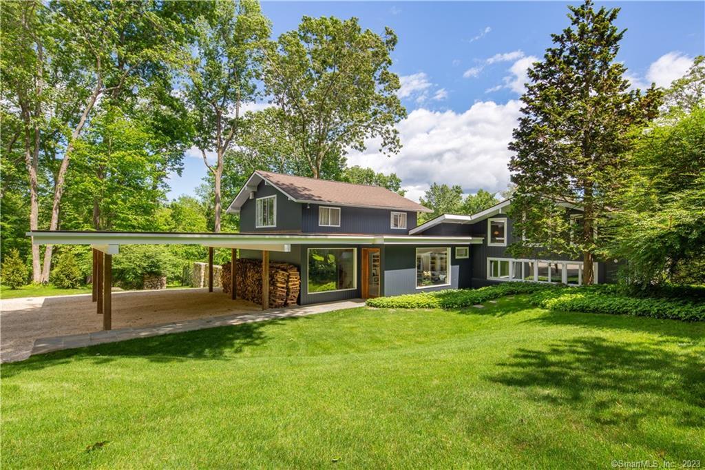 9 Hackberry Hill Road Weston, CT 06883 - Photo 1 of 1 a view of a house with a yard