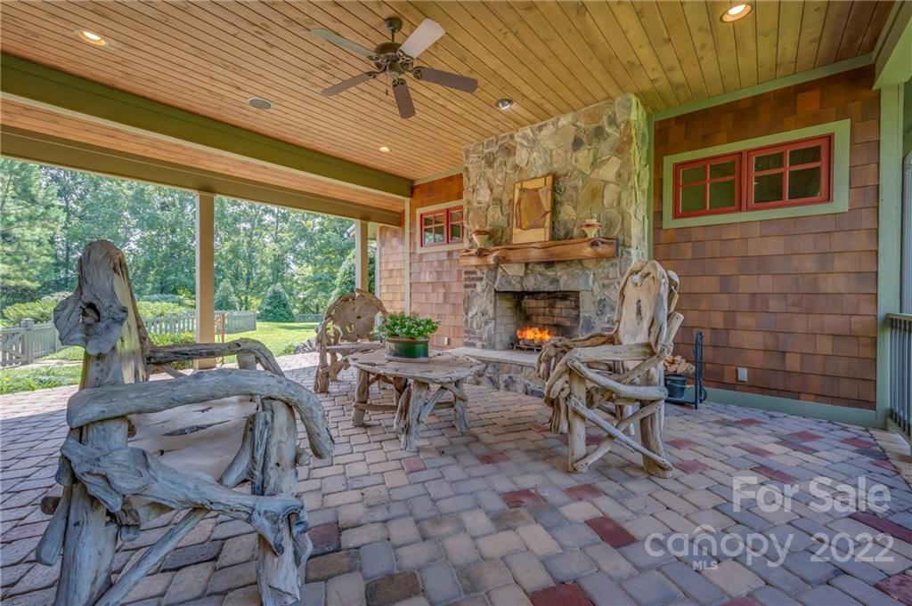 1360 South Phillips Road Columbus, NC 28722 - Photo 11 of 41 a view of a patio with table and chairs and potted plants
