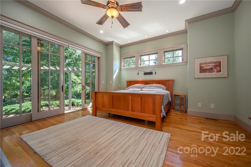 1360 South Phillips Road Columbus, NC 28722 - Photo 24 of 41 a bedroom with a bed and wooden floor