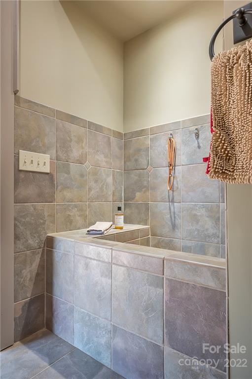 1360 South Phillips Road Columbus, NC 28722 - Photo 29 of 41 a bathroom with a granite countertop shower and a sink