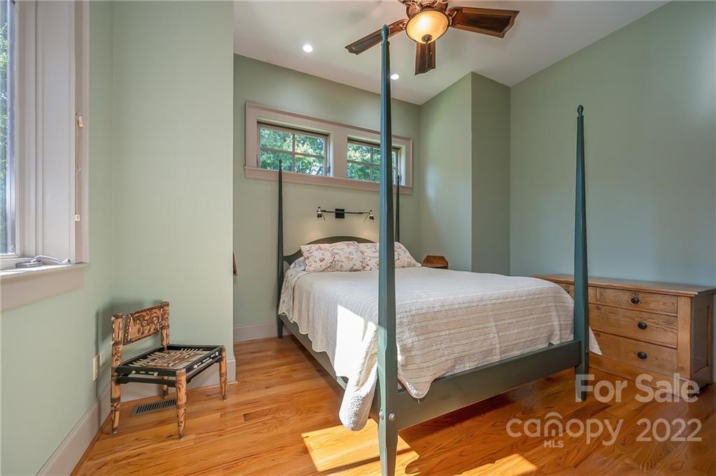 1360 South Phillips Road Columbus, NC 28722 - Photo 31 of 41 a bedroom with a bed and wooden floor