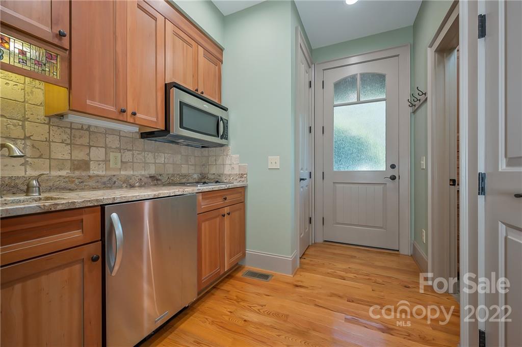 1360 South Phillips Road Columbus, NC 28722 - Photo 32 of 41 a kitchen with stainless steel appliances granite countertop a refrigerator and a sink