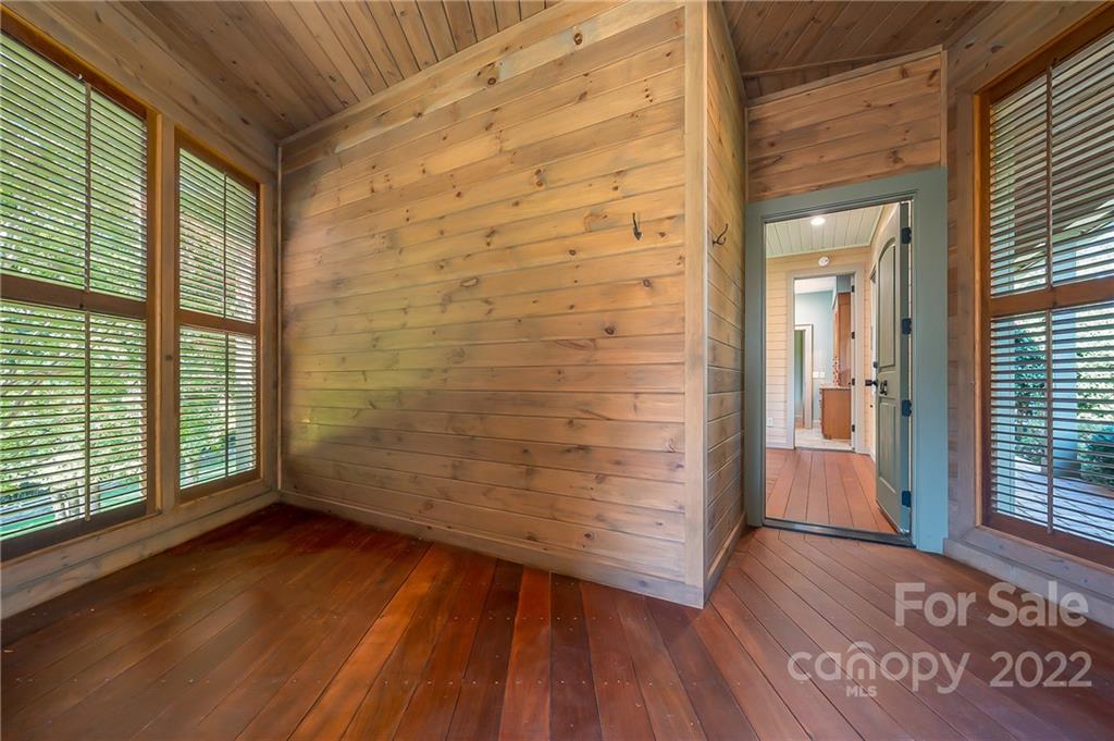 1360 South Phillips Road Columbus, NC 28722 - Photo 36 of 41 an empty room with wooden floor and windows