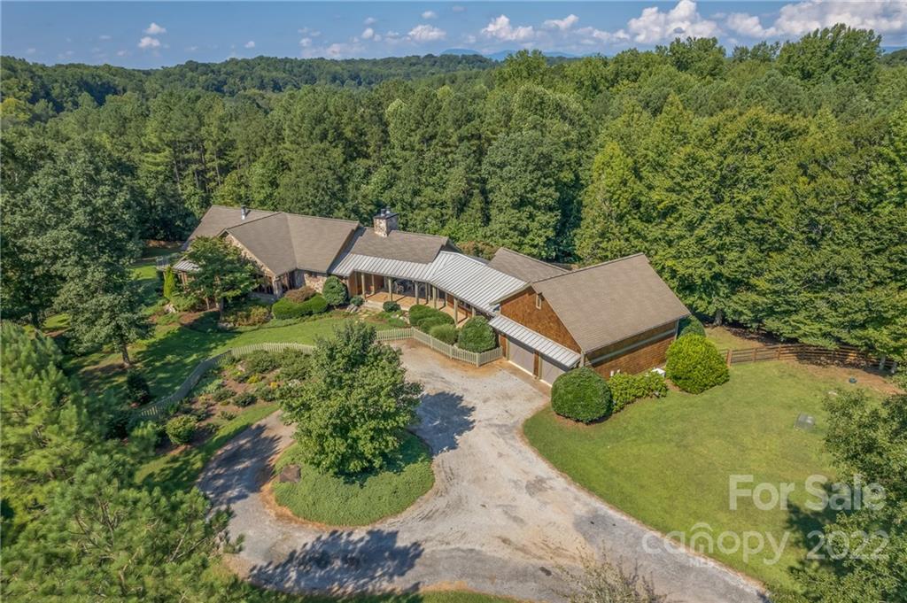 1360 South Phillips Road Columbus, NC 28722 - Photo 5 of 41 an aerial view of a house with a yard
